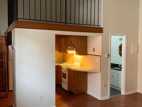 lofted bedroom above kitchen