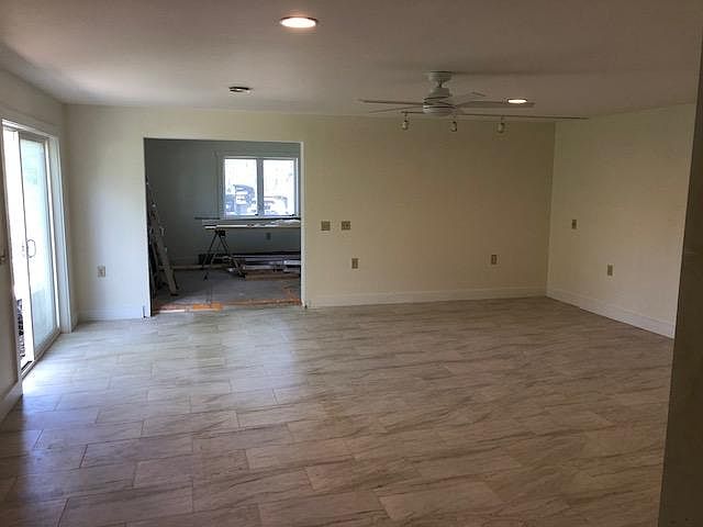 Large Step Down Living Room With New Tiled Flooring And Radiant Heat. Office Located Off The Living Room.