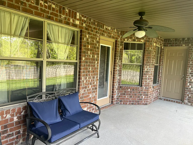 Back patio featuring the door to go into the living room and the other door goes into the secondary full bath with the two sinks. Yes the bathroom has access to the backyard.