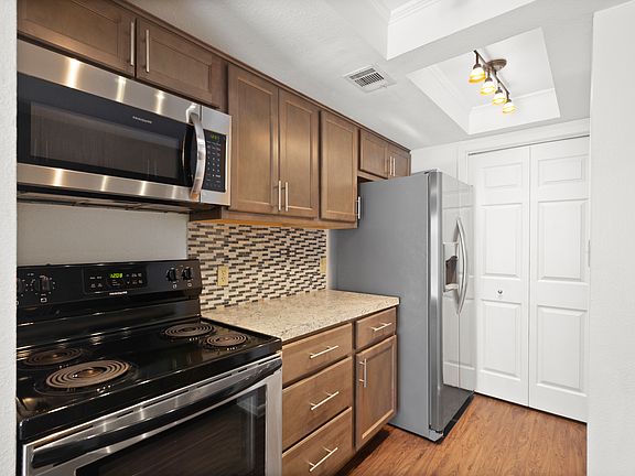 Side by Side fridge; microwave vent-a-hood.