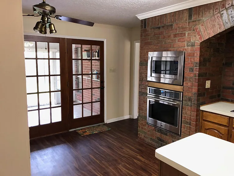 Kitchen appliances are new! Just to the left is the entrance from the living room. You can see the sunroom in this picture too.
