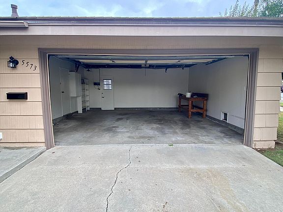 Large, two car garage with remote. Work bench and laundry hookups