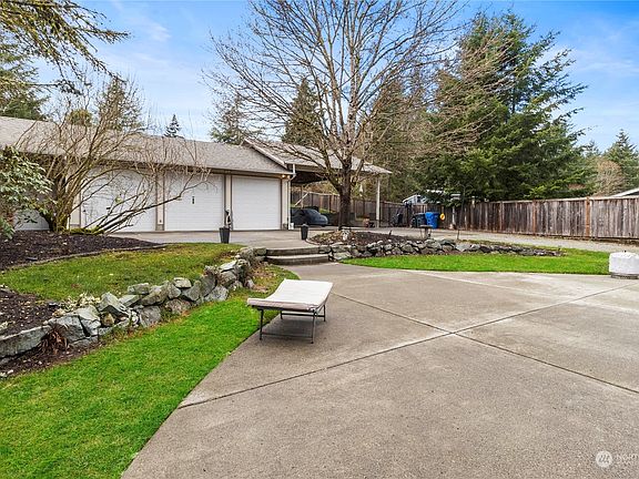 Large cement patio offers lots of possibilities.>