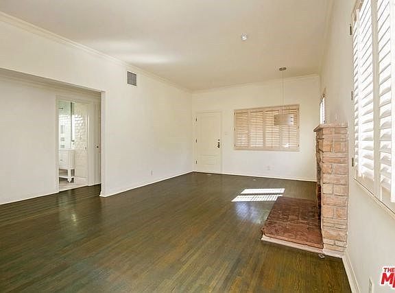 Living room with view to hall and bath