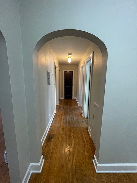 Standing in entry hallway looking towards bedroom (on left at end of hallway, Bathroom is on the right through the 1st door and kitchen is the 2nd doorway on the right. Livingroom is on the left in this pic.