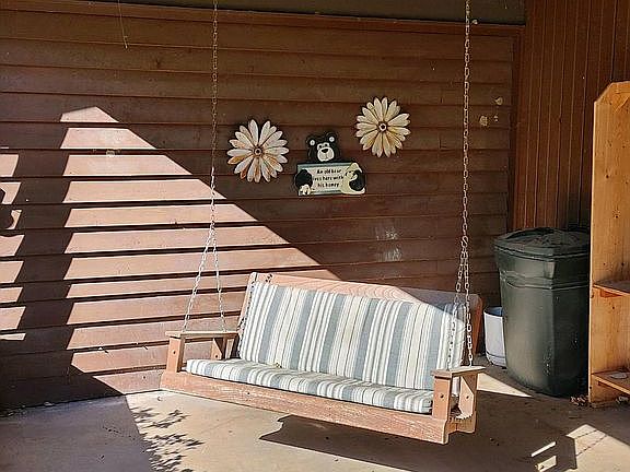 Carport with porch swing
