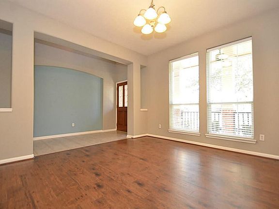 Wood laminate floors are a perfect touch to this formal dining room.