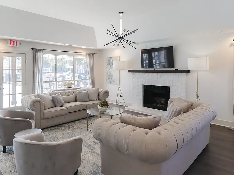 Our Montgomery apartments offer a welcoming community room with comfortable seating and fireplace, professionally operated by Highlands Vista Group.