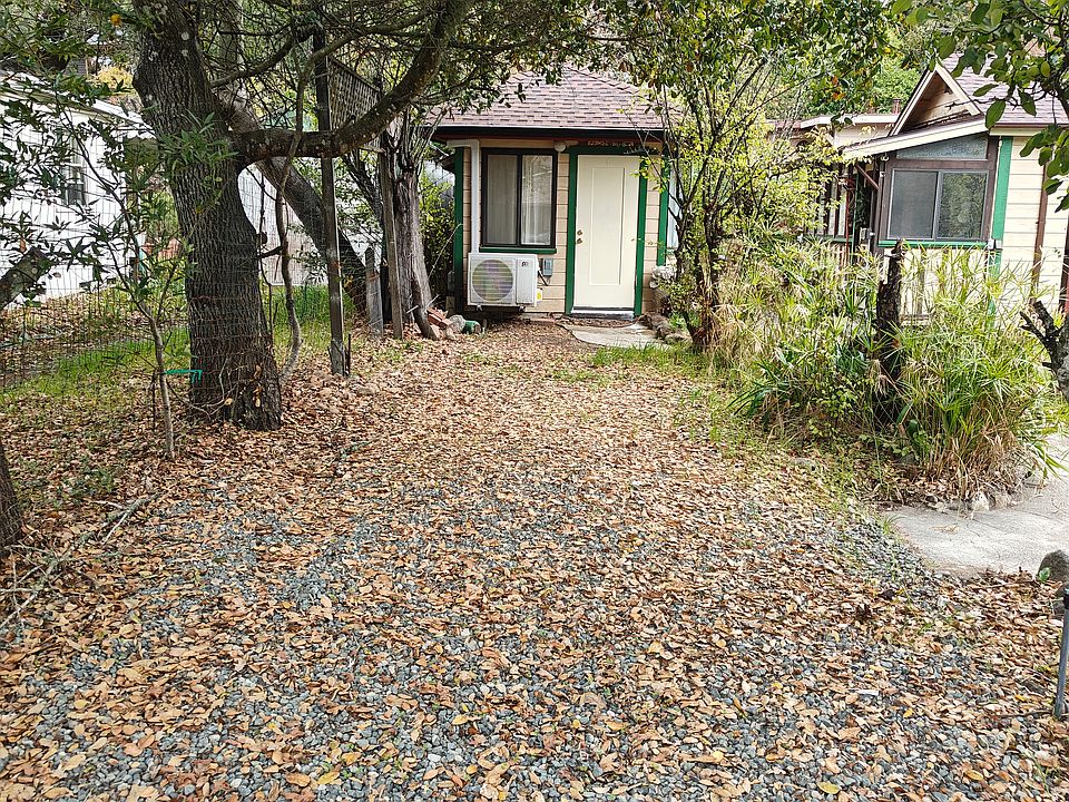 Carport and front of cottage. Holds two cars one in front of the other. Ready for class 2 charger.
