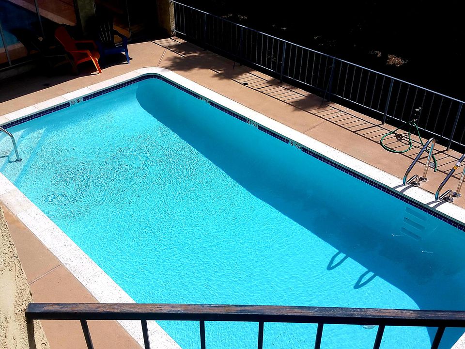 Pool is located in the back of the building in an elevated courtyard.