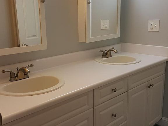 Double sink full bathroom with tub shower