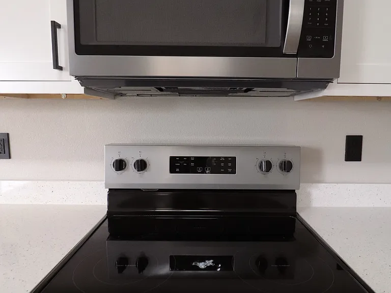 Brand new kitchen appliances never used, including stainless steel microwave and oven. Home is move-in ready with all appliances brand new.