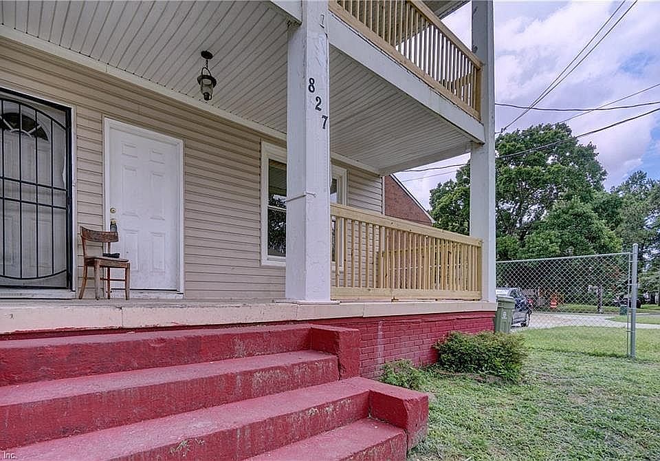 The downstairs unit boasts a large front porch and the upstairs unit offers a balcony.
