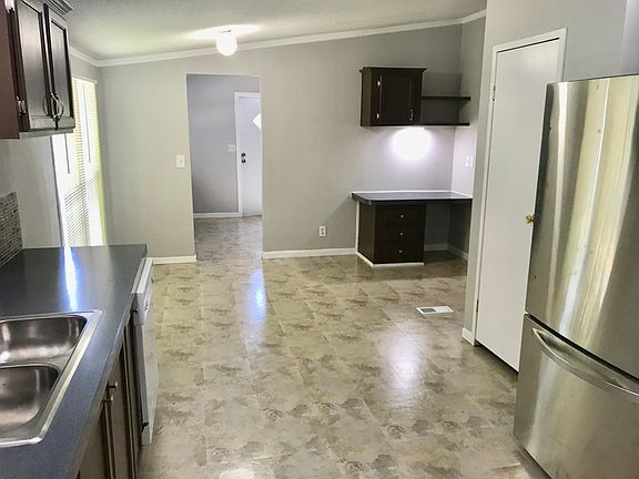 Kitchen and dining area, kitchen desk, entry to laundry