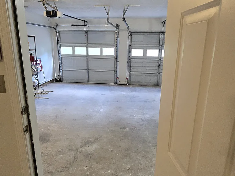 Door from den to garage.