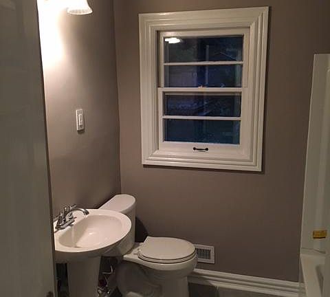 Bathroom features all new finishings, shelving, shower, tub