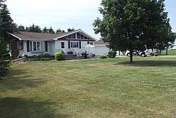 This attractive home features many new updates thru-out, including recently remodeled granite design kitchen countertops, appliances, pull out drawers in cabinets and stainless steel sink. New vinyle windows, patio door, insulated entry doors and garage door. 