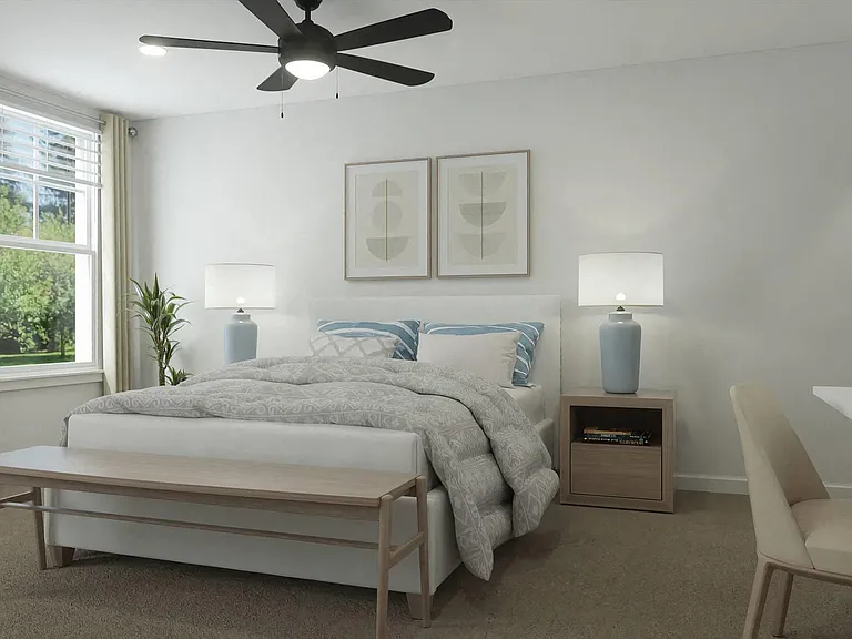 Queen-size bed and abundant natural light streaming through the window.