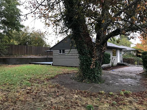 Side yard with cherry trees