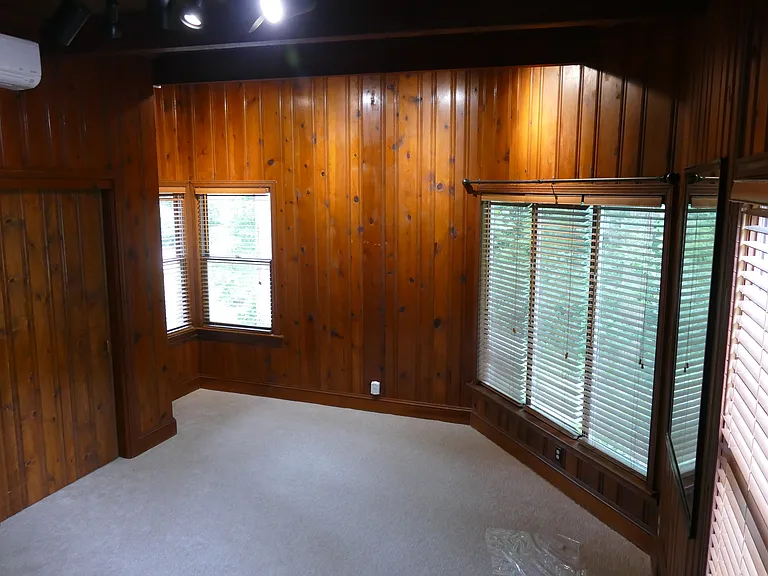 Large Master Bedroom with Views of spacious side yard.