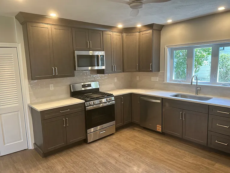 Gas Range, Microwave and Dishwasher. Double Sinks with Garbage Disposal.