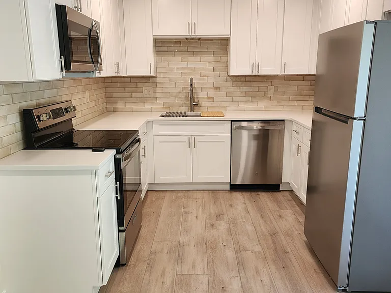 Kitchen with all new amenities and ample cabinets and counter space.