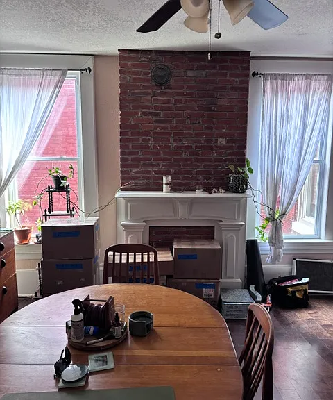 Livingroom/office #1 cont., exposed brick, lots of light, mantel