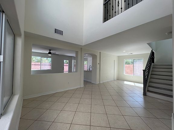 The front entrance leads into the living room and dining area.
