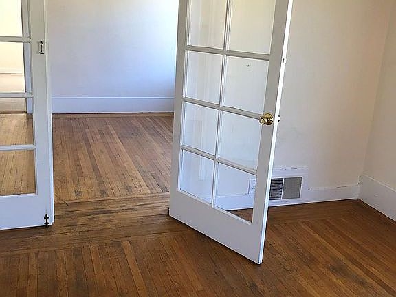 Dining room in the foreground, living room in the background.