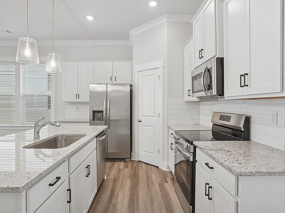 Welcoming Kitchens with Island and Stainless Steel Appliances