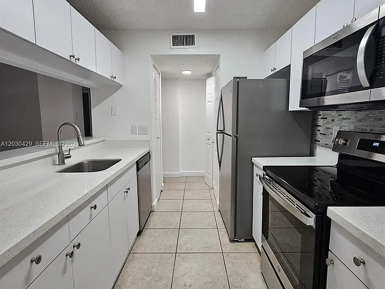 15771 SW 106th Ter #204 — Photo 24
