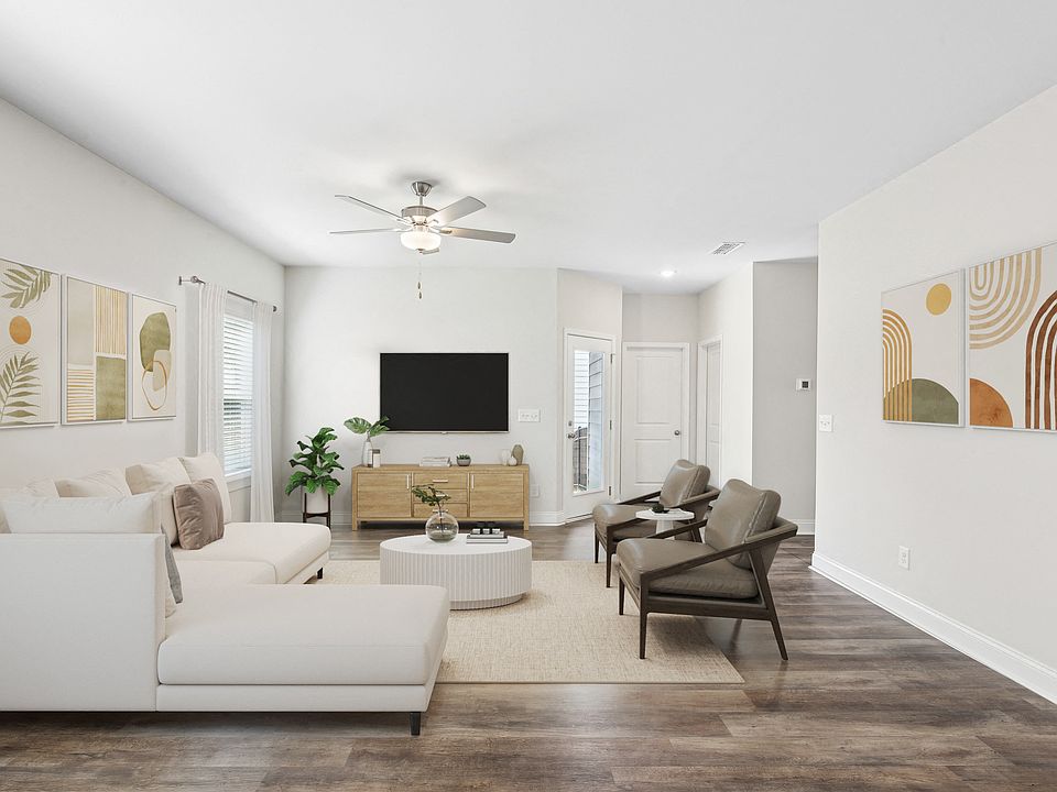 Living room with large window letting in a ton of natural light.