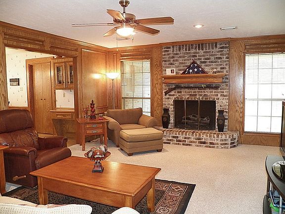 Spacious family room with wood burning fireplace.