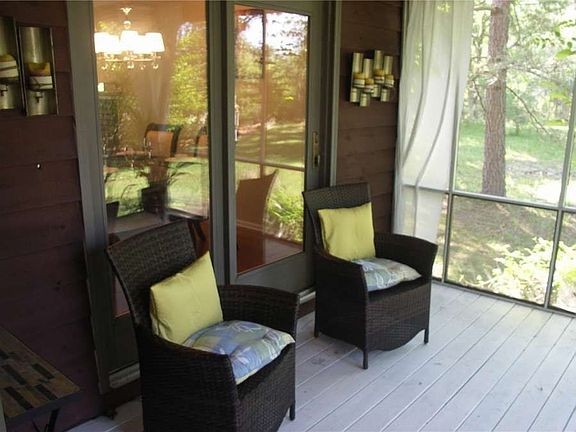 "Delightful screened porch for enjoying a little nature without the mosquitos!"