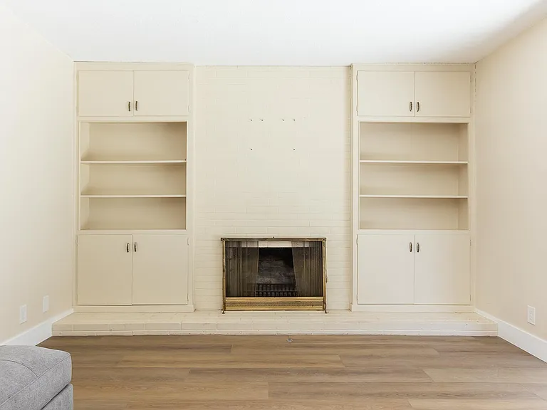 Living room shelves and fireplace