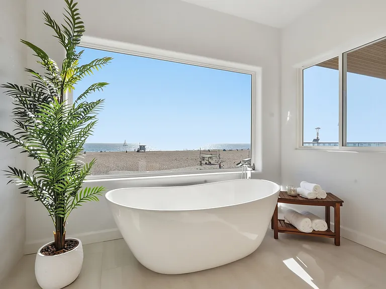 Primary bedroom features a covered balcony, fireplace, large spa bathroom, and incredibly spacious walk-in closet.