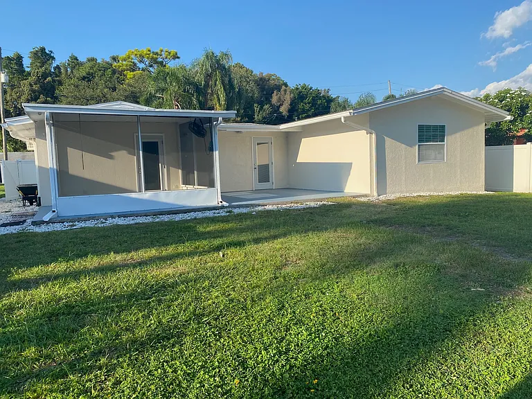 backyard with screened porch and open patio deck if sun cover is removed