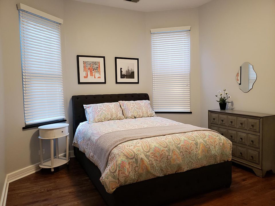 Main floor bedroom with queen size bed in picture