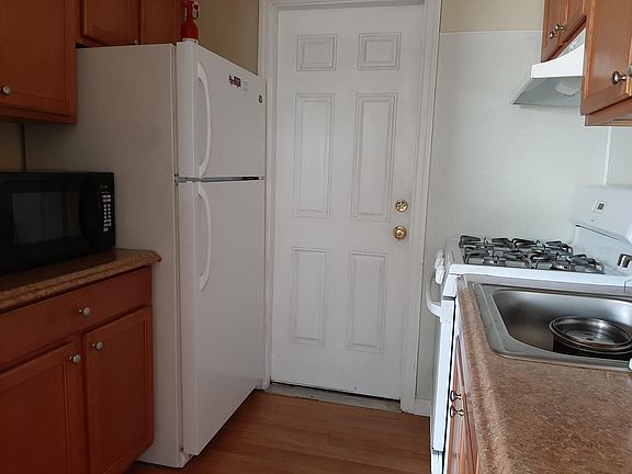 Plenty of wood cabinets