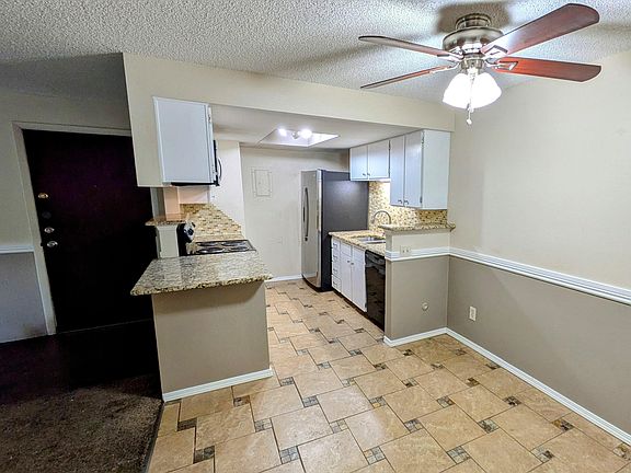 Kitchen with eating area. Ceiling fan, new refrigerator, built in microwave, stove/oven, dishwasher, pantry.