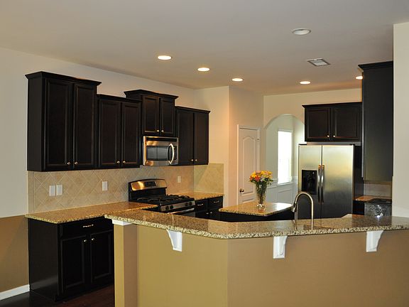 Open Kitchen with Center Island, Granite and Tile Backsplash