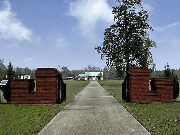 View of the home from the gated entrance