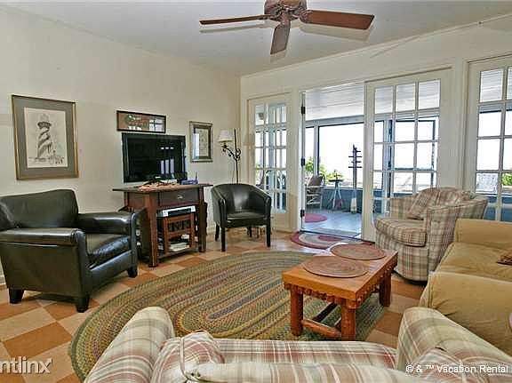 The living room combines sun and entertainment
