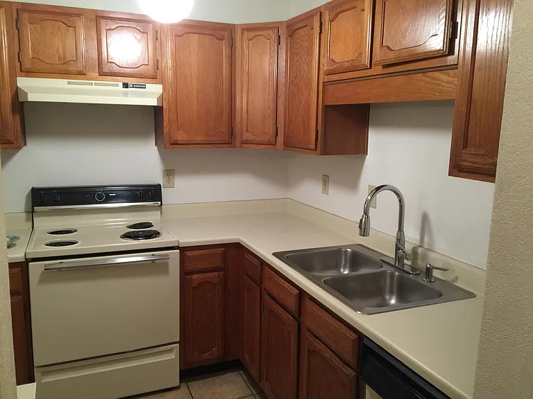 Kitchen has stainless steel appliances now.