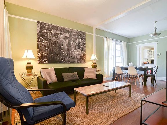 Spacious living room with tons of natural light- the perfect place to hang or entertain