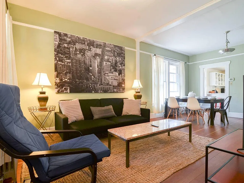 Spacious living room with tons of natural light- the perfect place to hang or entertain