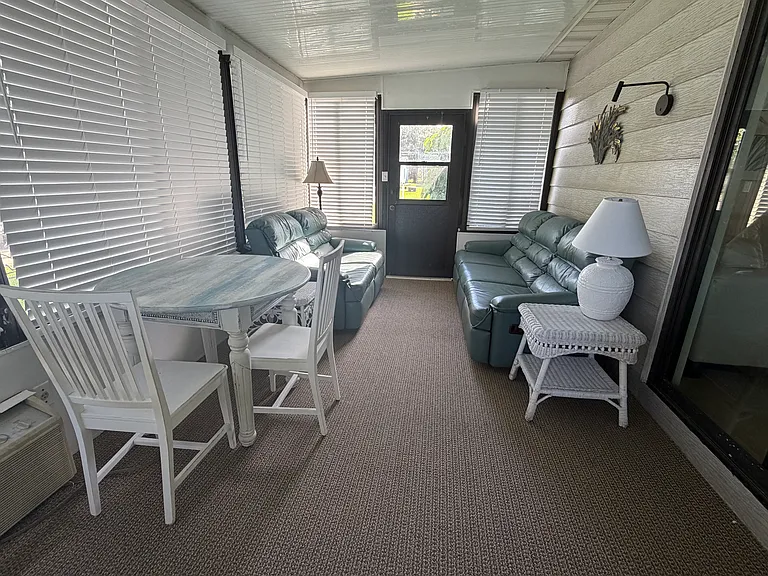 Furnished patio opening onto walkway down to dock
