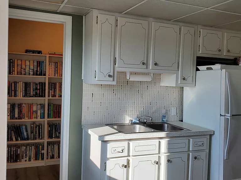 6th Floor Community room kitchen and library for residents' use