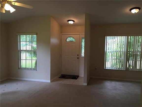 Entrance, with a formal living room and formal dining room area...