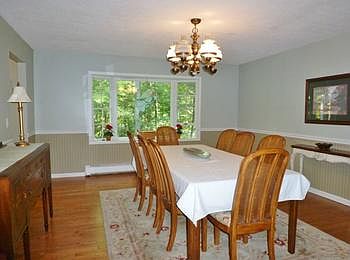 Formal dining room is spacious enough for large dining sets!